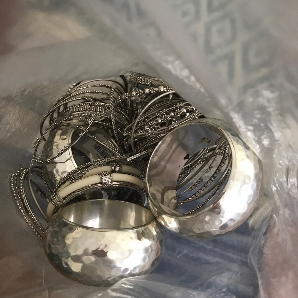 A bag of silver bracelets